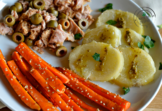 Tonno all’olio extra vergine di oliva con olive, carote brasate al sesamo e patate al pesto